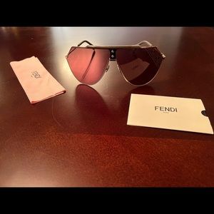 Fendi sunglasses unisex gold with fendi logo on the sides. BRAND NEW.